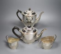 An Edwardian four piece demi-fluted oval silver tea and coffee set, Mappin & Webb, Sheffield,