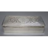 A continental white metal mounted rectangular cigarette box, with pierced engraved lid, 18.6cm,