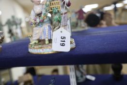 A Meissen figure group of a boy and girl with cage and garland, underglaze blue crossed sword marks,