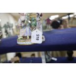 A Meissen figure group of a boy and girl with cage and garland, underglaze blue crossed sword marks,