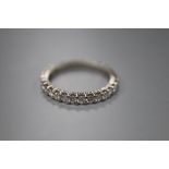 A platinum and diamond full eternity ring, claw-set with small round diamonds, size N, gross 2.8