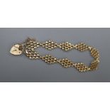 A 9ct yellow gold flexible link bracelet with padlock clasp, 5 grams.