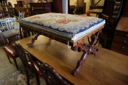 A William IV walnut X frame dressing stool with floral tapestry seat, width 100cm depth 65cm