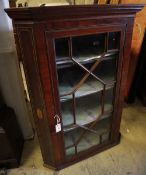 A George III inlaid mahogany hanging corner cabinet, width 83cm, depth 52cm, height 118cm