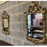 A pair of carved giltwood wall mirrors, with pierced frames, width 48cm, height 85cm