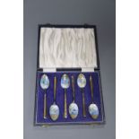 A cased set of six silver gilt and chinoiserie decorated enamel teaspoons, Birmingham, 1965.