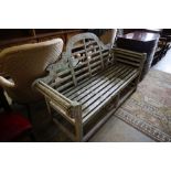 A Lutyens-style weathered teak garden bench, width 170cm height 106cm