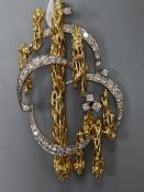 A mid 1970's 18ct two colour gold and graduated diamond set naturalistic brooch, 52mm, gross 14.2