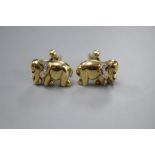 A pair of modern' yellow metal (stamped 750), diamond and cabochon ruby set elephant cufflinks,