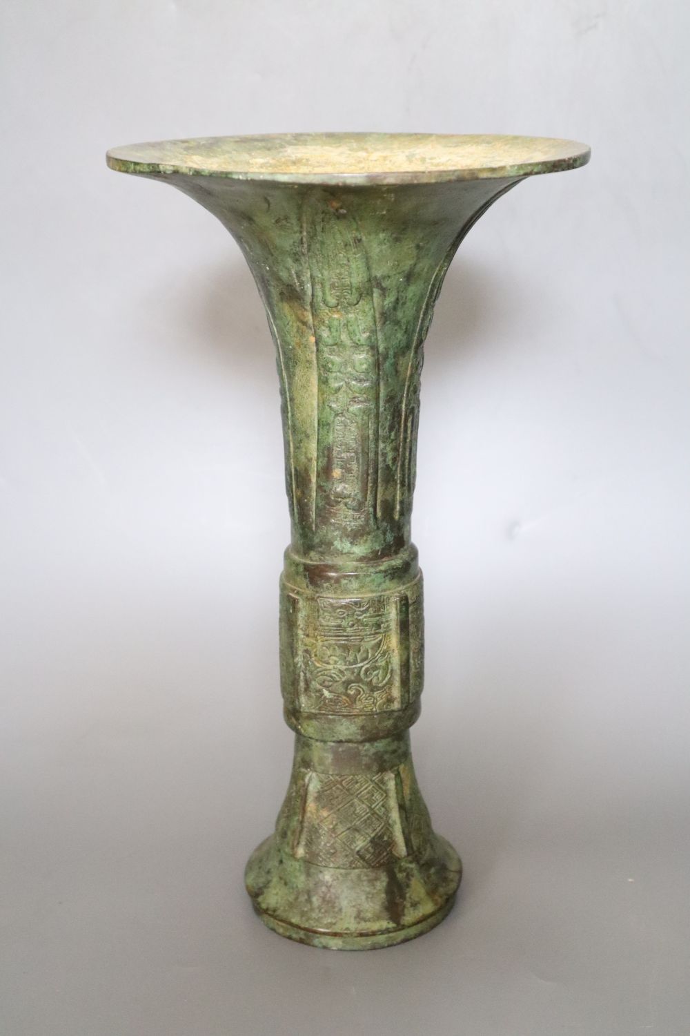 A Chinese archaistic bronze ritual vessel, Gu, Shang dynasty style