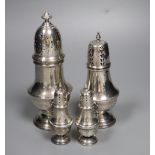 Four assorted 20th century silver casters, including a small pair, tallest 19.3cm, 11.5oz.