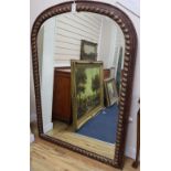 A Victorian style arched overmantel mirror, width 106cm, height 150cm