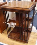 An Edwardian inlaid mahogany revolving bookcase, width 49cm, depth 49cm, height 77cm