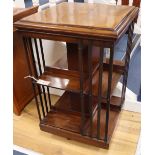 An Edwardian inlaid mahogany revolving bookcase, width 49cm, depth 49cm, height 77cm