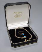 A cabochon turquoise-set oval pendant on 9ct gold fine chain and a similarly-set 9ct gold ring,