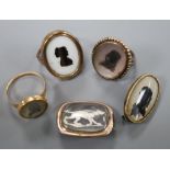 Three assorted Victorian yellow metal and glazed silhouette rings and two brooches, including