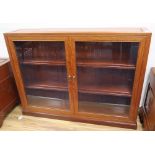 A Chinese hardwood glazed low bookcase, width 122cm, depth 25cm, height 92cm