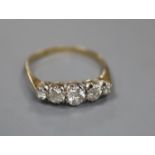 A yellow metal and graduated five stone diamond set half hoop ring, size O, gross 2.1 grams.