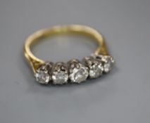 An 18ct and graduated five stone diamond set half hoop ring, size O, gross 3.6 grams.CONDITION: No