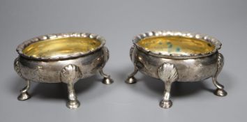 Two similar mid 18th century silver oval salts, London, 1753? and 1762, marks rubbed, length 8.