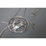 A Georg Jensen sterling 'kneeling deer' oval pendant, no. 95, on white metal chain, 42mm gross 14.