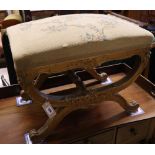 A 19th century giltwood X frame dressing stool, width 60cm, depth 40cm, height 46cm