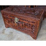 A Chinese carved camphorwood trunk, width 100cm depth 50cm height 58cm