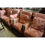 An early 20th century carved mahogany three piece bergere suite