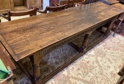 A 17th century style oak refectory table, width 262cm, depth 71cm, height 75cm