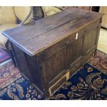 An 18th century panelled oak mule chest, width 118cm, depth 56cm, height 72cm