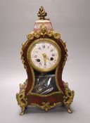 A 19th century French boullework and ormolu mounted mantel clock, dial signed by retailer Thos.