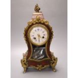 A 19th century French boullework and ormolu mounted mantel clock, dial signed by retailer Thos.