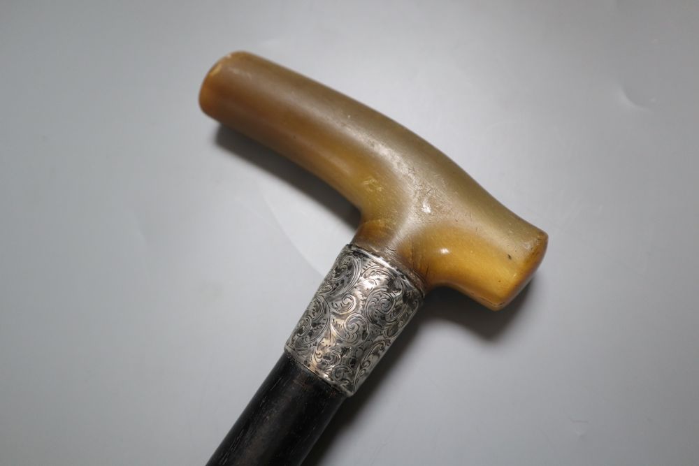 A silver mounted ebony walking cane with rhinoceros horn handle, 79cm - Image 3 of 4