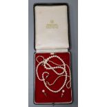 A single strand graduated cultured pear necklace with 9ct clasp, a pair of similar 9ct ear studs and