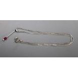 An 18ct white gold (750) pendant with ruby drop on bar and long link chain with silver clasp,