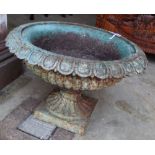 A Victorian cast iron campana garden urn on plinth, 52cm diameter, height 34cm