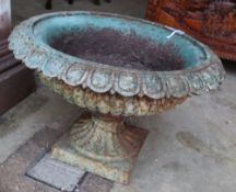 A Victorian cast iron campana garden urn on plinth, 52cm diameter, height 34cm