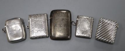 Three silver vesta cases, a sterling vesta case and a white metal vesta case, largest 61mm.