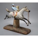 A cast coloured bisque porcelain horse and jockey group, height 26cmCONDITION: Horse tail appears to