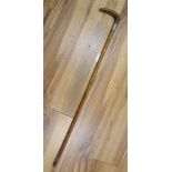 An Edwardian rhinoceros horn handled silver mounted walking stick, length 87cm