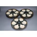 A set of five Longchamp maiolica oyster dishes, 24cm