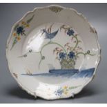 An 18th century faience dish, painted in polychrome enamels, 23cmCONDITION: Generally good with