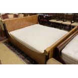 An Empire style bird's eye maple gilt metal mounted and part ebonised Superking 6ft. bed frame and