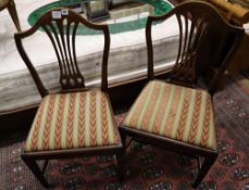 A set of four Hepplewhite style dining chairs (3 single, 1 arm) and four Edwardian dining chairs