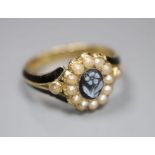 A Victorian 18ct gold, black enamel, seed pear and hardstone set oval mourning ring, inscribed '