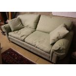 A modern Victorian-style two-seater settee, upholstered in patterned green fabric, width 220cm depth