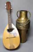 An Italian mandolin, maker's label within, G. Quagila, and an embossed brass two handled vase, 43cm