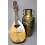 An Italian mandolin, maker's label within, G. Quagila, and an embossed brass two handled vase, 43cm