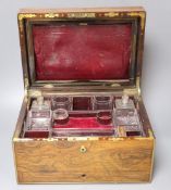 A Regency brass mounted rosewood toilet box, with glass contents and base drawer, width