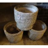 Three reconstituted stone circular garden planters, largest 35cm diameter